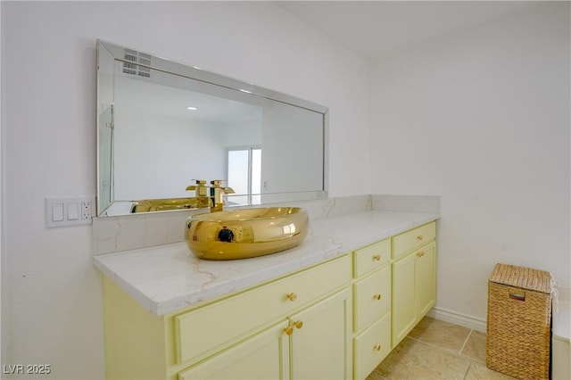 bathroom with vanity and tile patterned floors