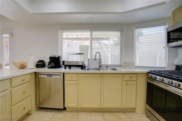 kitchen with stainless steel appliances, sink, and light tile patterned floors