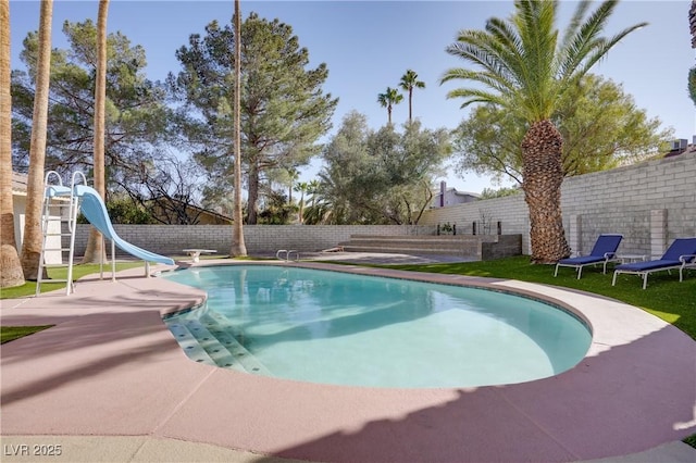 view of pool featuring a water slide