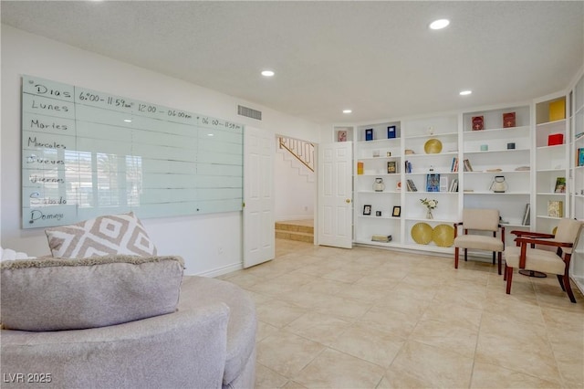 sitting room featuring built in features