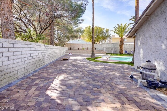 view of patio / terrace featuring a fenced in pool