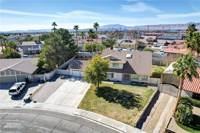 birds eye view of property featuring a mountain view