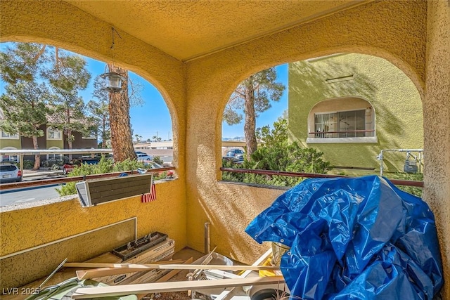 view of patio featuring a balcony