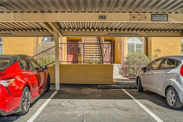7950 W Flamingo Rd Unit 1081, Las Vegas, NV 89147 - covered parking lot featuring stairs