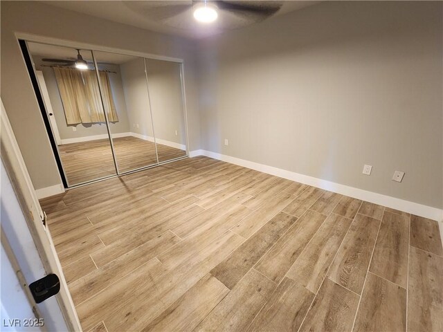 7950 W Flamingo Rd Unit 1081, Las Vegas, NV 89147 - unfurnished bedroom featuring wood finished floors, a closet, and ceiling fan