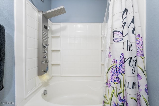 bathroom with shower / bath combo with shower curtain