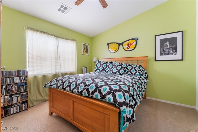 bedroom featuring ceiling fan, light colored carpet, and vaulted ceiling