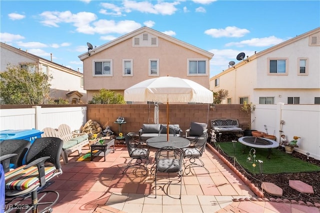 view of patio / terrace with a grill and an outdoor living space with a fire pit