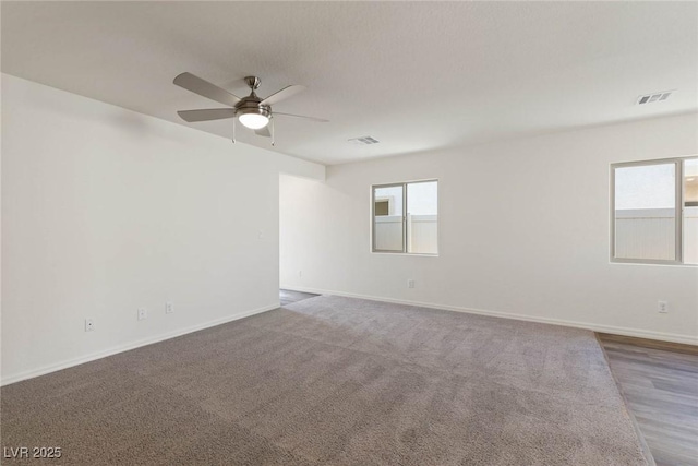 empty room featuring ceiling fan