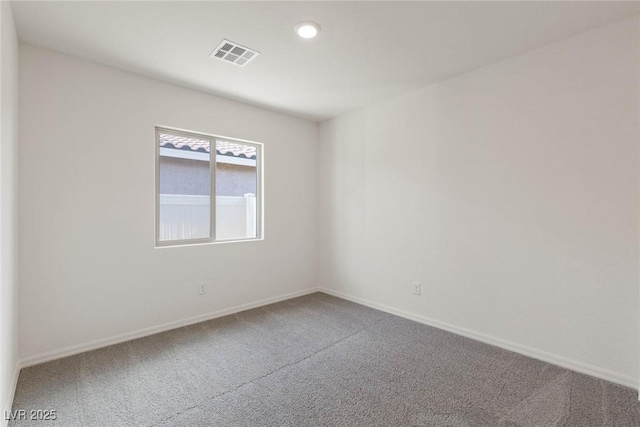 empty room featuring carpet flooring