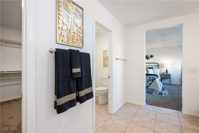 bathroom with tile patterned floors and toilet