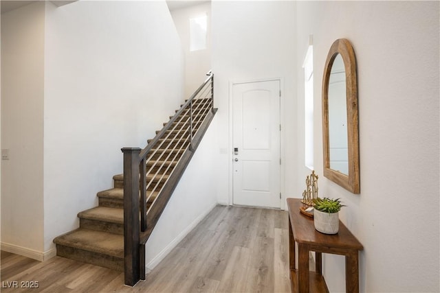 stairway featuring hardwood / wood-style floors