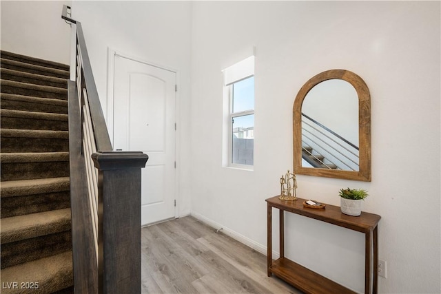 stairs with hardwood / wood-style flooring