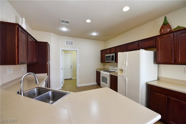 kitchen with white appliances and sink