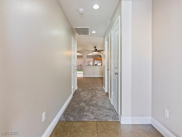 corridor featuring carpet floors