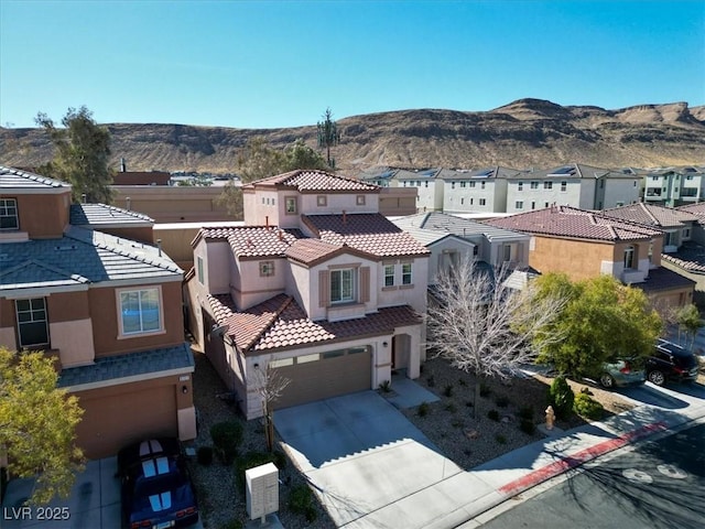 birds eye view of property featuring a mountain view