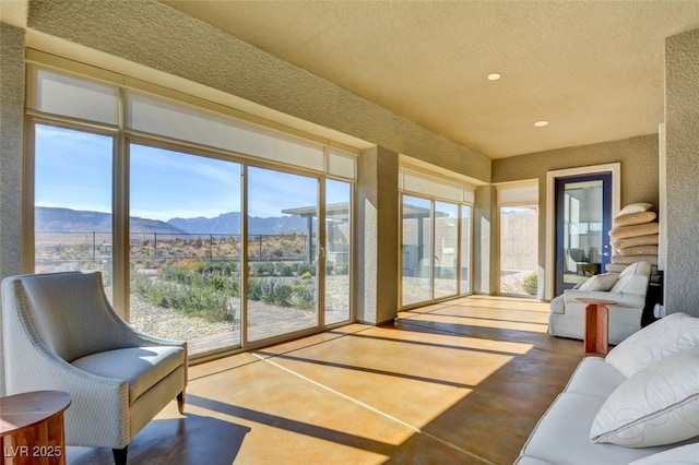 sunroom featuring a mountain view