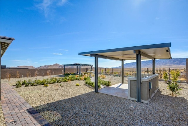 view of yard featuring a mountain view and a patio area