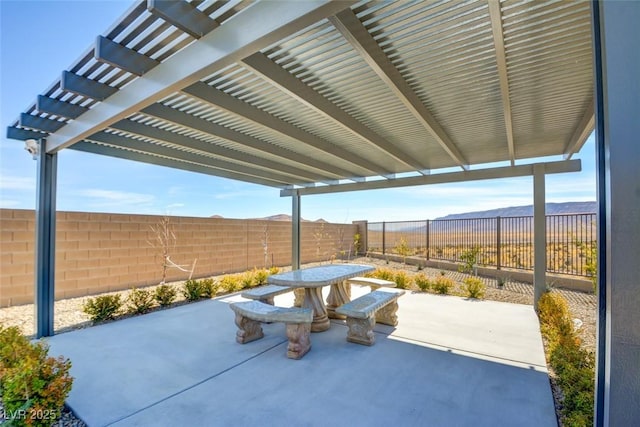 view of patio featuring a pergola and a mountain view