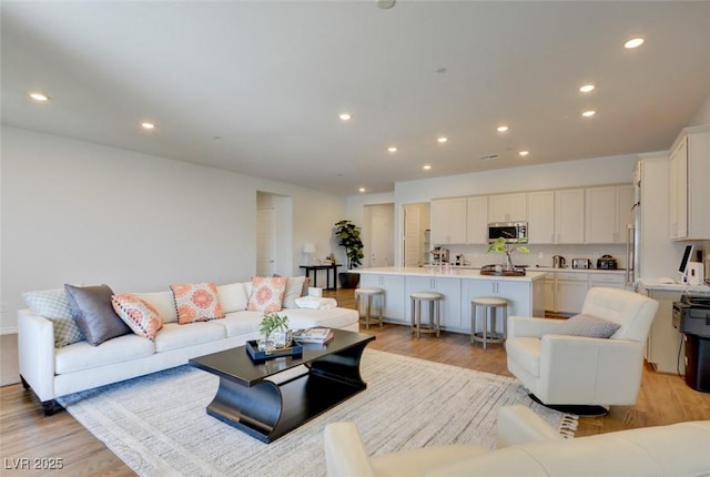 living room with light hardwood / wood-style floors