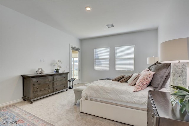 bedroom featuring light carpet