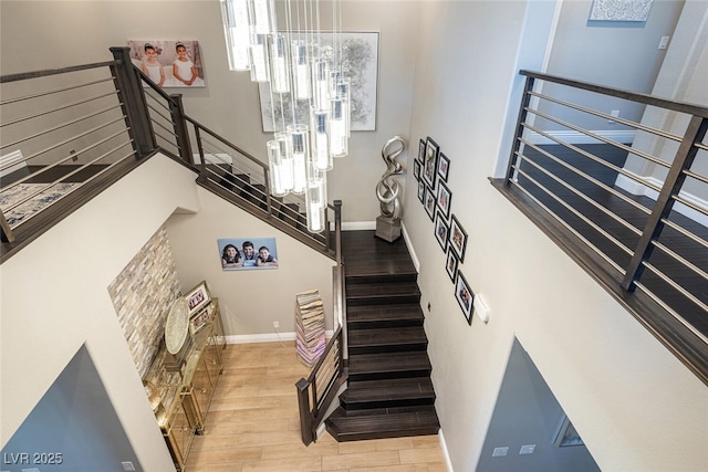 staircase with wood-type flooring