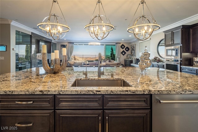 kitchen featuring pendant lighting, sink, and a chandelier