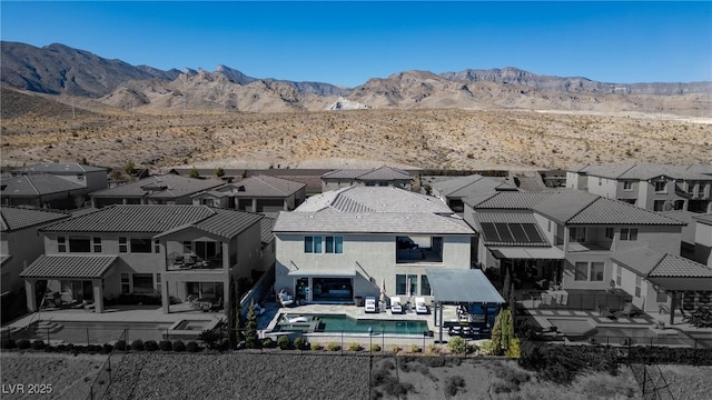 birds eye view of property with a mountain view