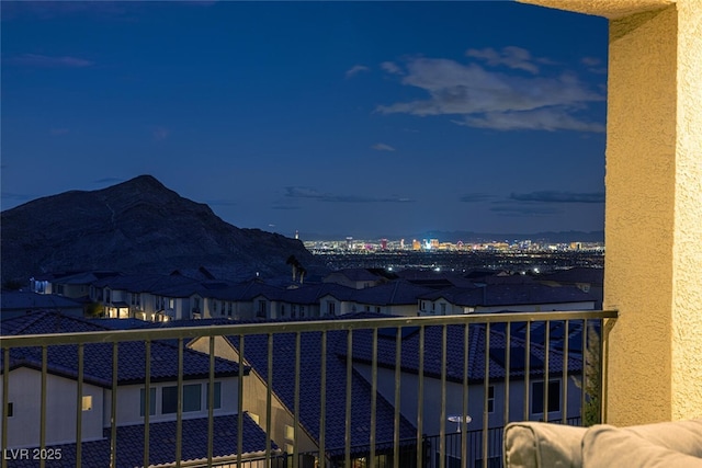 balcony at dusk with a mountain view