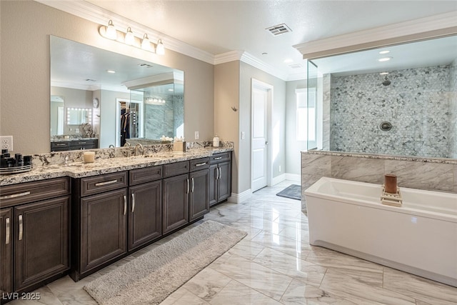 bathroom with vanity, crown molding, and separate shower and tub