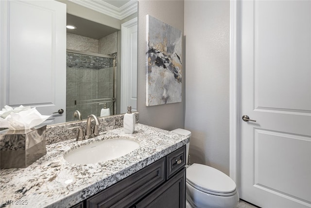 bathroom with walk in shower, vanity, crown molding, and toilet