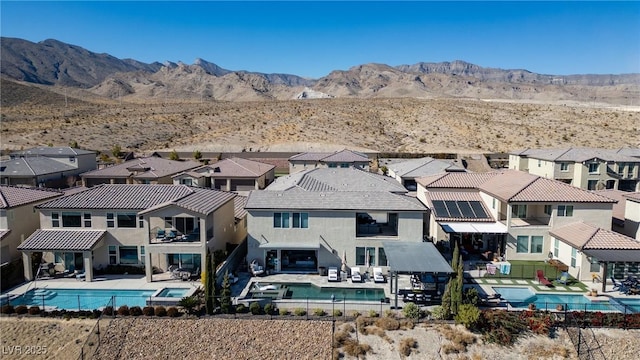 rear view of property featuring a mountain view