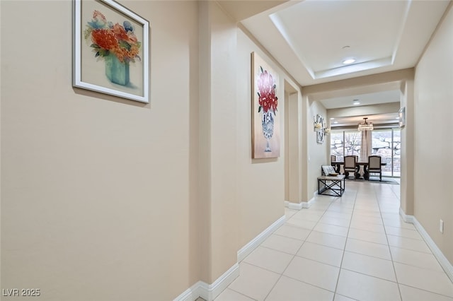 hall featuring light tile patterned floors