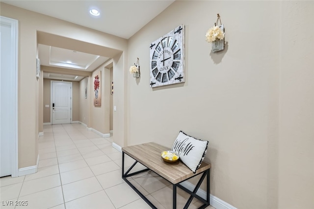 corridor featuring light tile patterned flooring