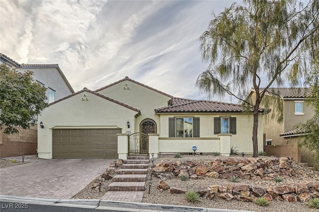 mediterranean / spanish-style home featuring a garage