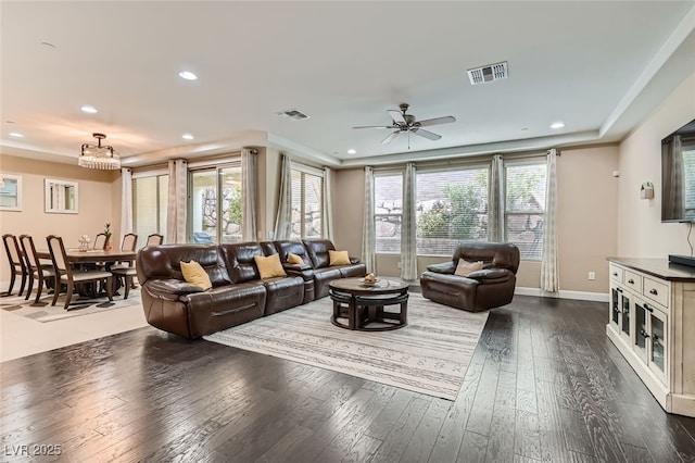 living room with dark hardwood / wood-style floors and ceiling fan