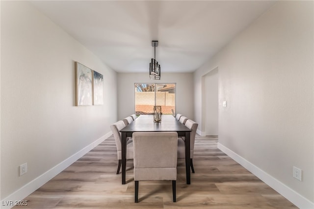 dining area with wood-type flooring