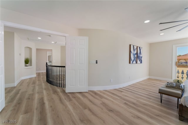 interior space with ceiling fan and light wood-type flooring