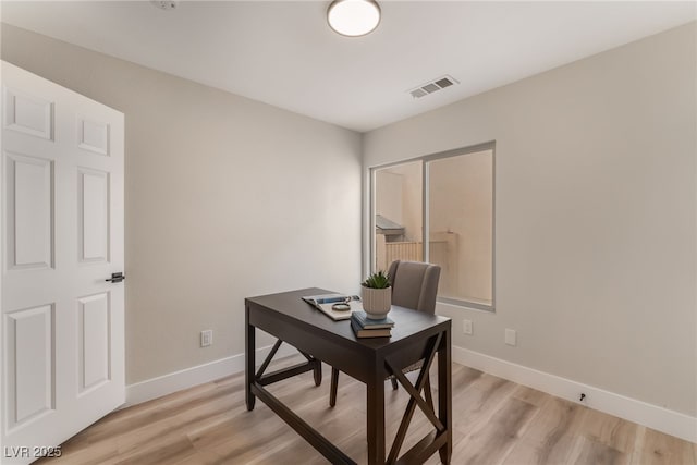 office area with light wood-type flooring