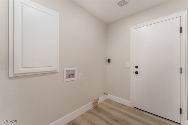 laundry area with hookup for a gas dryer, hookup for a washing machine, and light hardwood / wood-style flooring