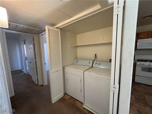 clothes washing area with independent washer and dryer