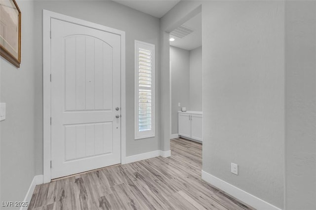 entrance foyer with light hardwood / wood-style floors