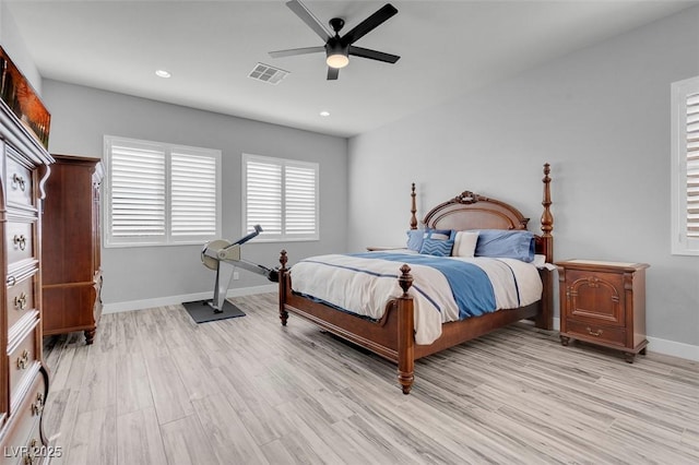 bedroom with ceiling fan and light wood-type flooring