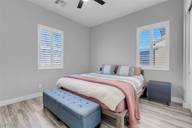 bedroom with ceiling fan and light hardwood / wood-style flooring