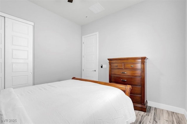 bedroom with ceiling fan and light hardwood / wood-style floors