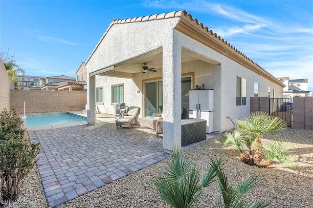 back of house featuring ceiling fan and a patio