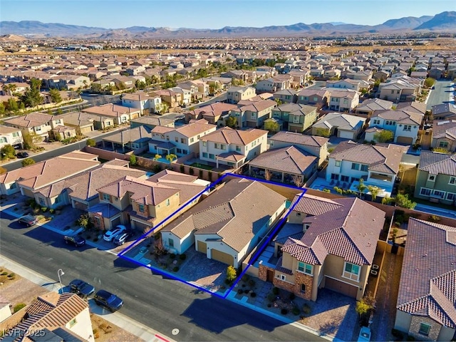 birds eye view of property featuring a mountain view