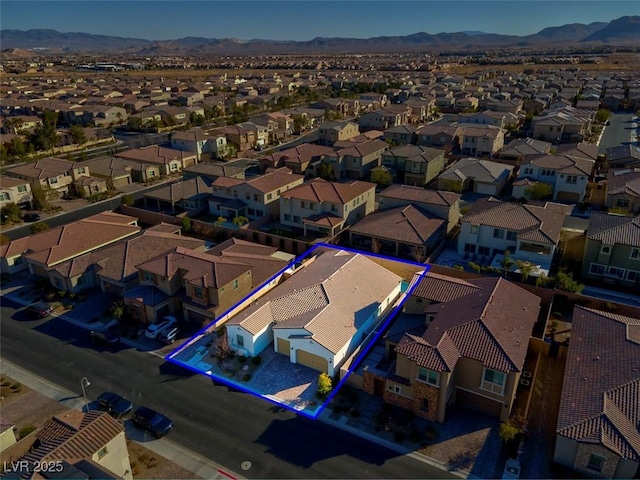 birds eye view of property featuring a mountain view