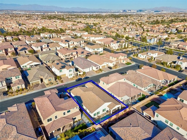 birds eye view of property featuring a mountain view