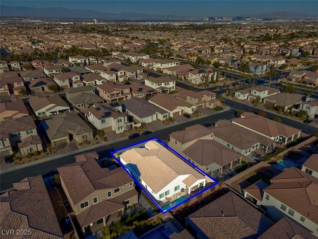 birds eye view of property featuring a mountain view